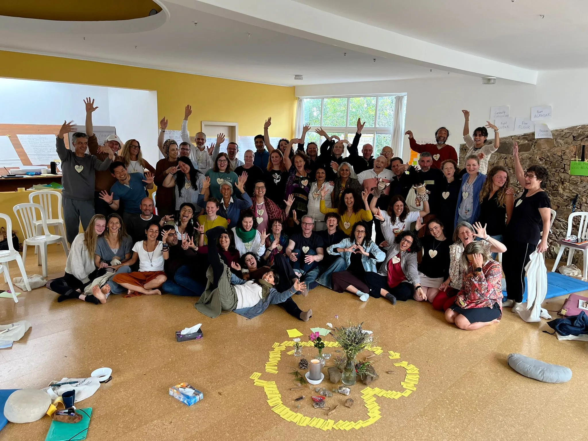 The whole group cheering together in a circle, image 3 of 13